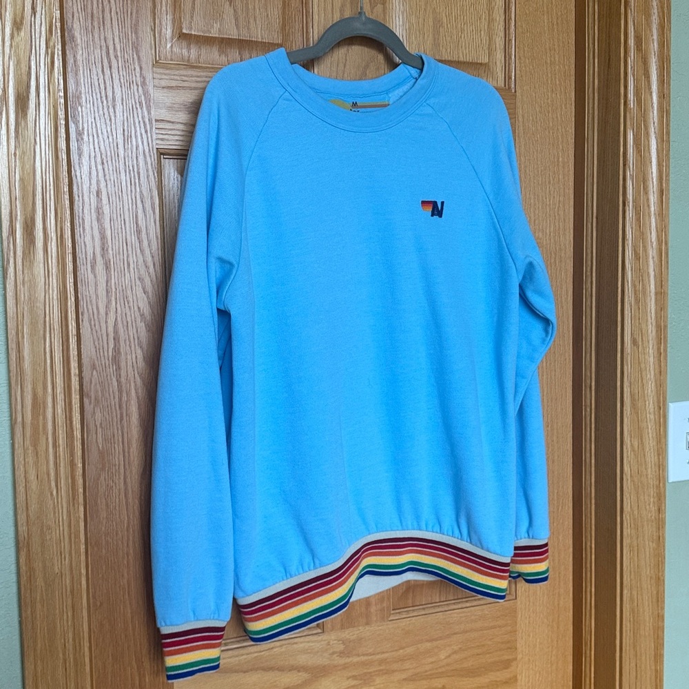Light Blue Sweater with Rainbow Trim